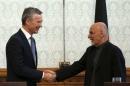 NATO Secretary General Jens Stoltenberg (L) shakes hands with Afghanistan's President Ashraf Ghani during a news conference in Kabul, Afghanistan