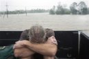 A resident of Plaquemines Parish who was rescued from his flooded home sits in the back of a pickup truck during Hurricane Isaac in Braithwaite