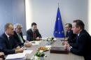 British Prime Minister Cameron attends a bilateral meeting with European Council President Tusk and European Commission President Juncker in Brussels