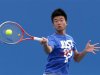 Wu Di of China serves during a practice session at the Australian Open tennis tournament in Melbourne
