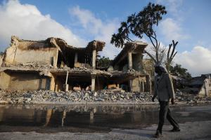 A civilian walks past a destroyed building in Mogadishu&nbsp;&hellip;