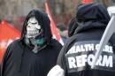 File photo of activist wearing skull mask during protest against reforms to healthcare system in Moscow