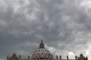 File photo of clouds over Saint Peter cathedral at the Vatican
