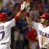 Texas Rangers' Moreland is congratulated by Martin after hitting a home run against the Houston Astros in the eighth inning of their MLB interleague baseball game in Arlington