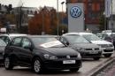 Volkswagen cars are parked outside a VW dealership in London