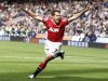 Manchester United's Owen celebrates after scoring during their English Premier League soccer match against Bolton Wanderers at the Reebok Stadium in Bolton