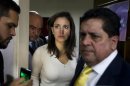 Venezuelan opposition lawmaker Machado arrives at a news conference after a fight in parliament in Caracas