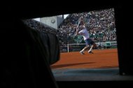 Switzerland's Roger Federer serves against India's Somdev Devvarman in their second round match of the French Open tennis tournament, at Roland Garros stadium in Paris, Wednesday, May 29, 2013. Federer won in three sets 6-2, 6-1, 6-1. (AP Photo/Petr David Josek)