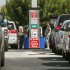 Costco members fill up with discounted gasoline at a Costco gas station in Van Nuys, Calif., Friday, Oct. 5, 2012.  Californians woke up to a shock Friday as overnight gasoline prices jumped by as much as 20 cents a gallon in some areas, ending a week of soaring costs that saw some stations close and others charge record prices. (AP Photo/Damian Dovarganes)