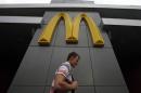A man walks past a closed McDonald's restaurant, one of four temporarily closed by the state food safety watchdog, in Moscow