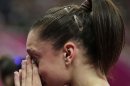 U.S. gymnast Jordyn Wieber cries after she failed to qualify for the women's all-around finals during the Artistic Gymnastics women's qualification at the 2012 Summer Olympics, Sunday, July 29, 2012, in London. (AP Photo/Gregory Bull)