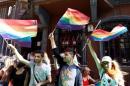 LGBT rights activists wave rainbow flags during a transgender pride parade which was banned by the governorship, in central Istanbul