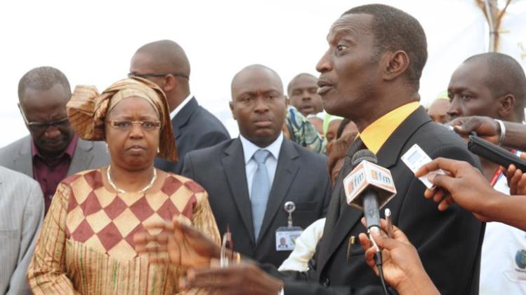 Senegal&#39;s health minister Awa Marie Coll Seck (2nd L) listens to Alioune Fall (R), chief doctor of Dakar airport, as she visits the airport on April 8, 2014
