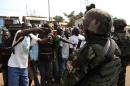 Angry men point at AU soldiers at Gobongo district in Bangui