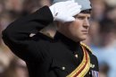 Prince Harry salutes during a wreath laying ceremony at the Tomb of the Unknowns at Arlington National Cemetery in Arlington, Va Friday, May 10, 2013. (AP Photo/Carolyn Kaster)
