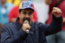 Venezuela's President Nicolas Maduro gestures as he talks to supporters during a rally to commemorate May Day, in Caracas
