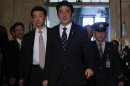 Japan's PM Abe walks to an ordinary session at the lower house of parliament in Tokyo