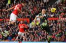 Manchester United's forward Javier Hernandez (L) scores United's third goal during their English Premier League football match against Stoke City at Old Trafford in Manchester, northwest England on October 26, 2013