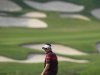 Poulter of England looks back on the 15th fairway during the final day of the WGC-HSBC Champions Tournament at Mission Hills in Dongguan
