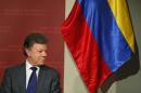 Colombian President Juan Manuel Santos waits to speak at the Kennedy School of Government at Harvard University in Cambridge