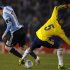 Messi of Argentina tries to dribbles the ball under pressure from Ramirez of Colombia during 2014 World Cup qualifying match in Buenos Aires