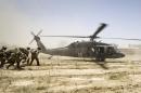 File photo of U.S. Army soldiers carrying Sgt. Matt Krumwiede towards a Blackhawk Medevac helicopter in southern Afghanistan