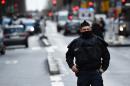 A French police officer stands guard at the Boulevard de Barbes in northern Paris, on January 7, 2016