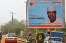 A picture taken on February 2, 2016 in Niamey shows a campaign poster depicting Niger's leading opposition figure Hama Amadou, jailed since November 2015 over his alleged involvement in a baby-trafficking scandal