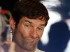 Red Bull Formula One driver Webber gestures inside his garage during the first practice session of the Abu Dhabi F1 Grand Prix at the Yas Marina circuit on Yas Island