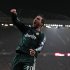 Real Madrid's Gonzalo Higuain from Argentina celebrates after his cross was turned in by Cristiano Ronaldo from Portugal to give his team the lead during their Champions League round of 16 soccer match at Old Trafford Stadium, Manchester, England, Tuesday, March 5, 2013. (AP Photo/Jon Super)