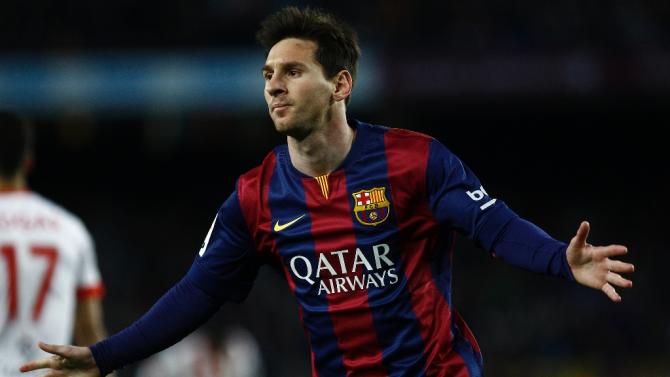 Barcelona&#39;s forward Lionel Messi celebrates a goal during the Spanish league football match against Almeria at the Camp Nou stadium in Barcelona on April 8, 2015