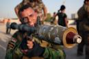 A newly-recruited Iraqi volunteer holds a weapon during a training session on June 20, 2014, in the southern city of Basra