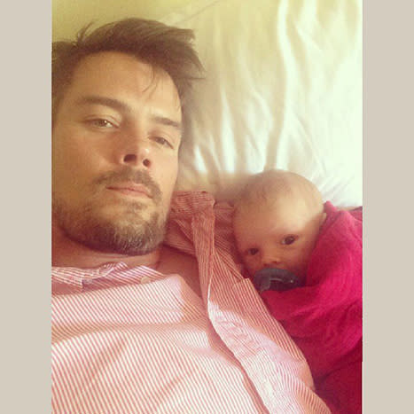 Josh Duhamel Cuddles Up to Baby Boy Axl to Watch Football: Picture