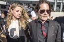 Actor Johnny Depp and wife Amber Heard arrive at the Southport Magistrates Court on Australia's Gold Coast