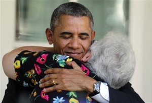 U.S. President Barack Obama hugs a woman after he speaks …