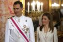 (L-R) Spain's Crown Prince Felipe and Princess Letizia attend a reception marking Spain's Armed Forces Day at the Royal palace in Madrid on June 8, 2014