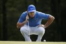 Rory McIlroy lines up a putt on the 18th hole during the third round of the Deutsche Bank Championship golf tournament in Norton, Mass., Sunday, Aug. 31, 2014. (AP Photo/Michael Dwyer)