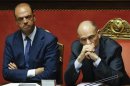 Italy's Prime Minister Letta looks on next to Interior Minister Alfano during a vote session at the Senate in Rome