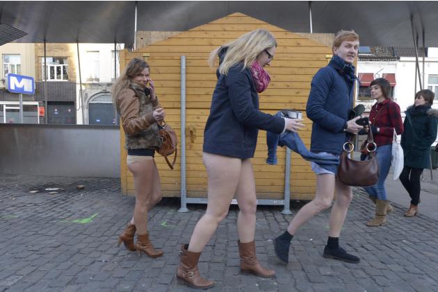 People take part in the annual "No Pants Subway Ride" celebrations on the streets of Brussels