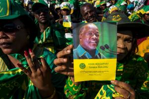 A supporter holds a booklet with a photo of presidential&nbsp;&hellip;