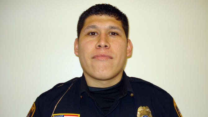 In this undated photo provided by Elmore police, officer Jose <b>Andy Chavez</b> is <b>...</b> - f64f44b49725f9094d0f6a7067002109