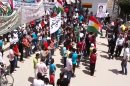 This image made from amateur video released by the Shaam News Network and accessed Friday, May 4, 2012, purports to show Syrians chanting slogans and caring Kurdish flags during a demonstration in Qamishli, the capital of Syria's Kurdish heartland. (AP Photo/Shaam News Network via AP video) TV OUT, THE ASSOCIATED PRESS CANNOT INDEPENDENTLY VERIFY THE CONTENT, DATE, LOCATION OR AUTHENTICITY OF THIS MATERIAL