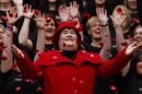 Singer Susan Boyle smiles as poppy's fall over her at a photocall during the launch of the Poppy Scotland appeal in Glasgow, Scotland