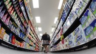 A shopper walks down an aisle in a newly opened Walmart Neighborhood Market in Chicago in this September 21, 2011 file photo. REUTERS/Jim Young/Files