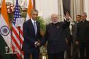 U.S. President Barack Obama, left and Indian Prime Minister Narendra Modi pose for the media after their talks, in New Delhi, India, Sunday, Jan. 25, 2015. Seizing on their personal bond, Obama and Modi said Sunday they had made progress on nuclear cooperation and climate change, with Obama declaring a "breakthrough understanding" in efforts to free U.S. investment in nuclear energy development in India. (AP Photo /Manish Swarup)