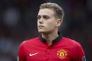 Manchester United debutant James Wilson takes to the pitch before his team's English Premier League soccer match against Hull at Old Trafford Stadium, Manchester, England, Tuesday May 6, 2014. (AP Photo/Jon Super)