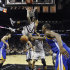 San Antonio Spurs' Danny Green scores over Golden State Warriors' Andrew Bogut, left, and Harrison Barnes (40) during the second half in Game 5 of a Western Conference semifinal NBA basketball playoff series, Tuesday, May 14, 2013, in San Antonio. (AP Photo/Eric Gay)