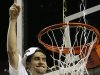Mississippi guard Marshall Henderson (22) prepares to cut part of the net after Mississippi  defeated Florida during the second half of an NCAA college basketball game in the final round of the Southeastern Conference tournament, Sunday, March 17, 2013, in Nashville, Tenn. Mississippi  won 66-63. (AP Photo/Dave Martin)