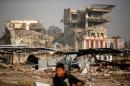 Buildings destroyed during previous clashes are seen as Iraqi forces battle with Islamic State militants in Mosul