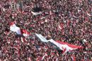 Supporters of Moqtada al-Sadr display a huge Iraqi flag during a protest against government corruption at Tahrir Square in Baghdad
